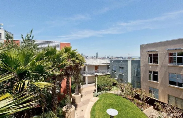 a view of backyard with outdoor space and trees