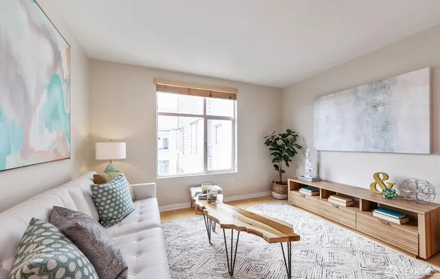 a bedroom with furniture and a window