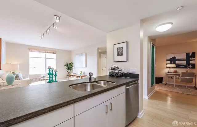 a kitchen with sink and center island