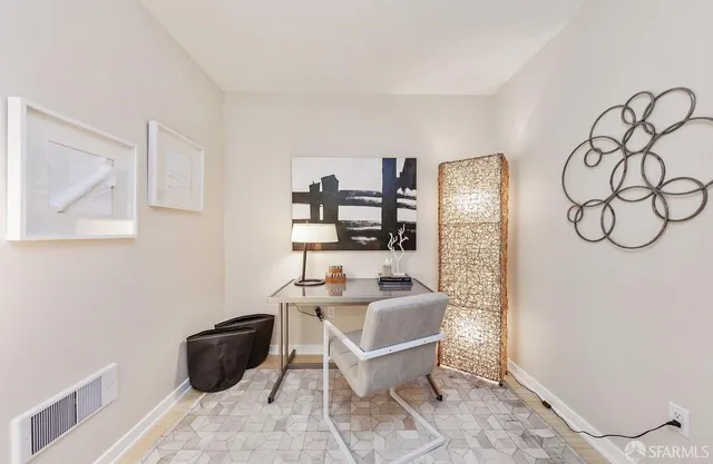 a view of a workspace with furniture