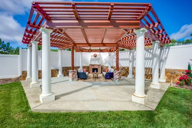 a view of a garage with a couch and a ceiling fan