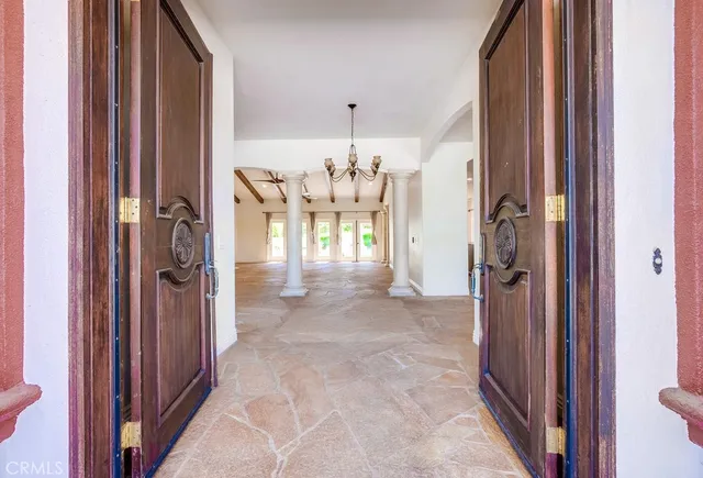 a view of a hallway with dining area