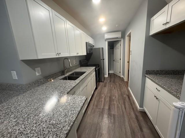 351 Valley View Circle Southeast Calhoun, GA 30701 - Photo 5 of 17 a kitchen with granite countertop lots of counter top space and stainless steel appliances