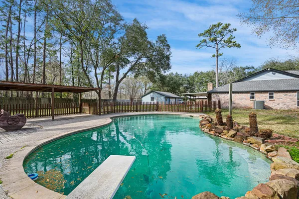 a view of a swimming pool with a patio