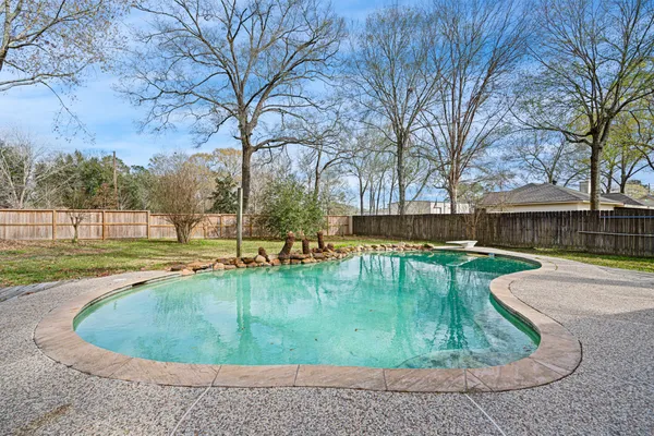 a view of a swimming pool with a patio