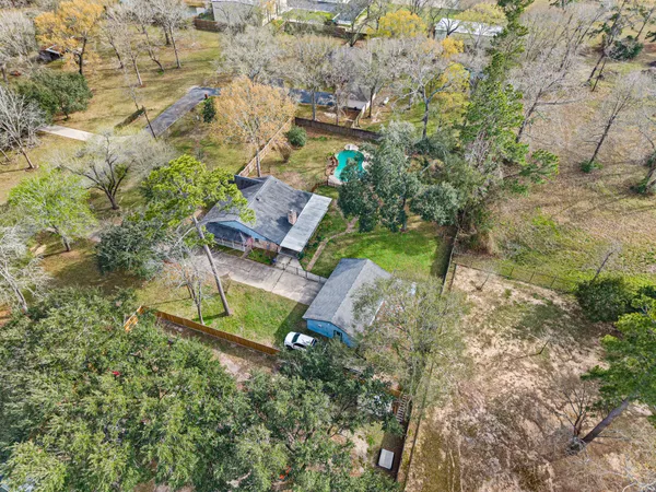 an aerial view of a house with a yard