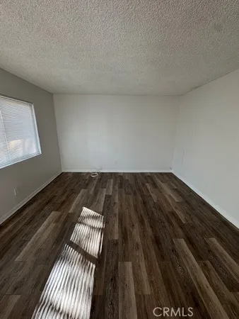a view of wooden floor in an empty room