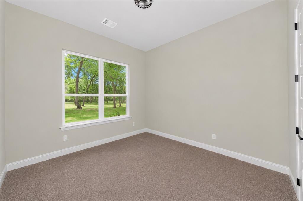 1057 Vh Ranch Poolville, TX 76487 - Photo 23 of 38 an empty room with a window