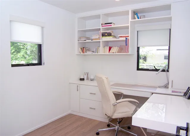 a workspace with furniture and window