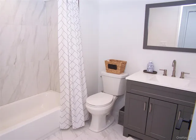 a bathroom with a sink a toilet and a bathtub