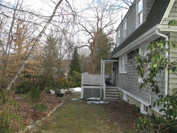 85-81 Hillside Road Wellesley, MA 02481 - Photo 19 of 24 a view of a house with a yard and large tree