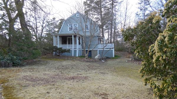 85-81 Hillside Road Wellesley, MA 02481 - Photo 23 of 24 a front view of a house with a yard and garage