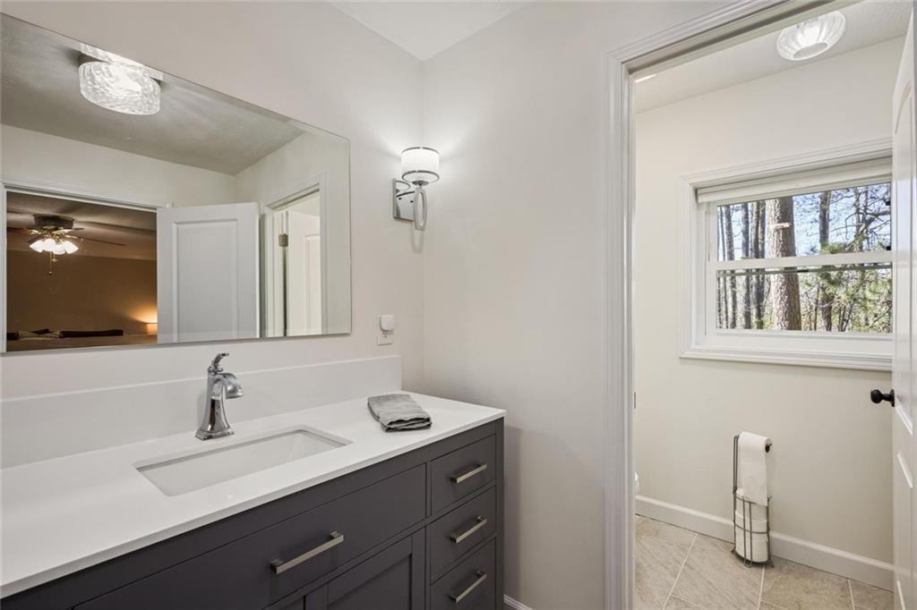 4505 Cochran Mill Road Fairburn, GA 30213 - Photo 24 of 36 a bathroom with a sink and a mirror