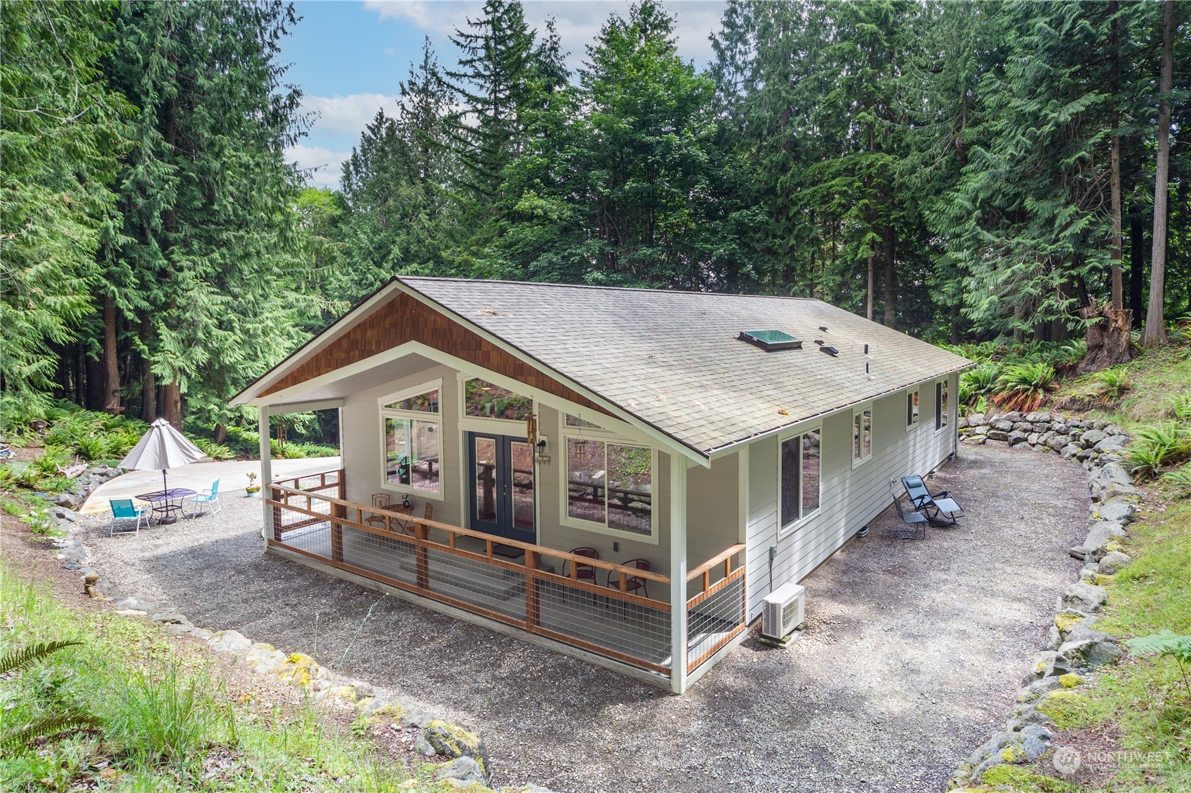 137 Windridge Road Chimacum, WA 98325 - Photo 29 of 40 a view of a house with a yard and large trees