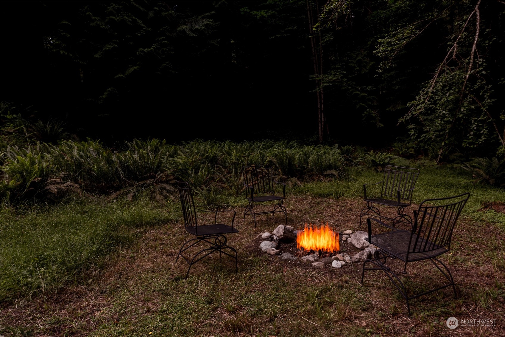 137 Windridge Road Chimacum, WA 98325 - Photo 39 of 40 a view of a swimming pool with a fire pit and outdoor seating