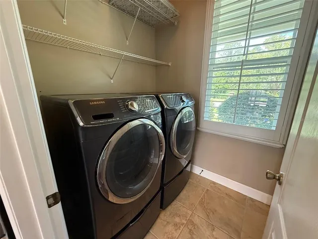 a utility room with dryer and washer