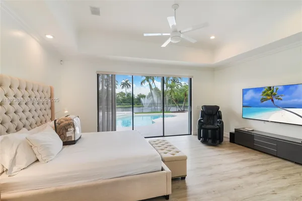 a bedroom with a bed and glass window