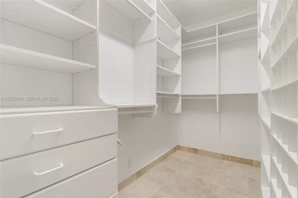 a view of an empty walk in closet