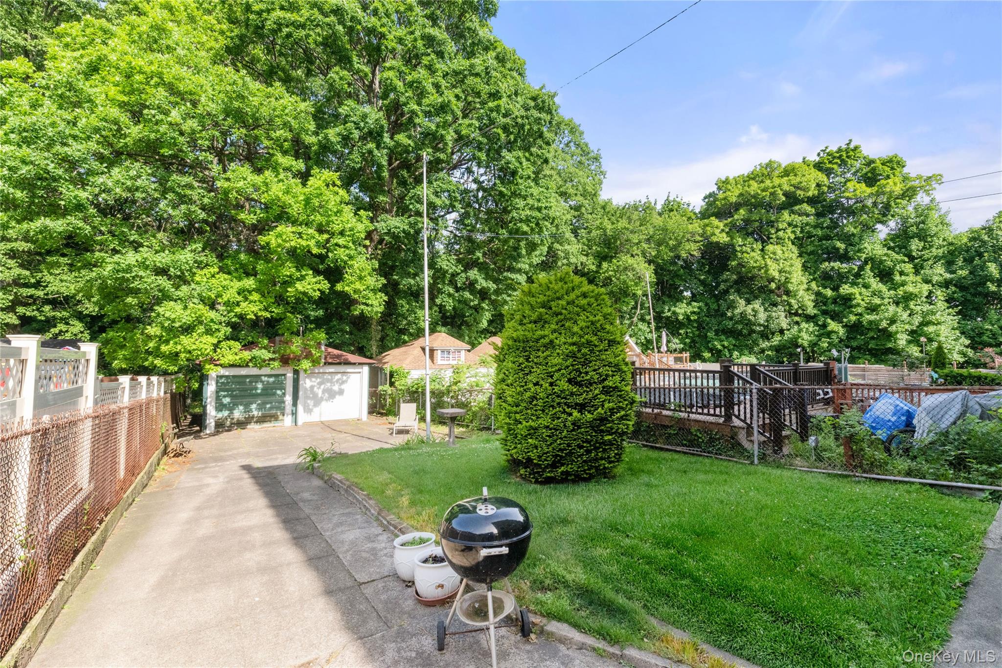 82-72 88th Place Queens, NY 11421 - Photo 25 of 26 a view of a backyard with sitting area