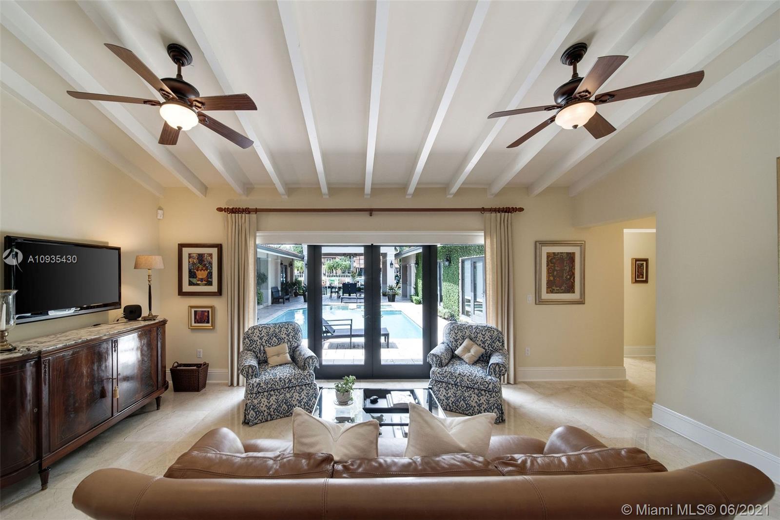 4804 Biltmore Drive Coral Gables, FL 33146 - Photo 14 of 47 a living room with furniture and a flat screen tv
