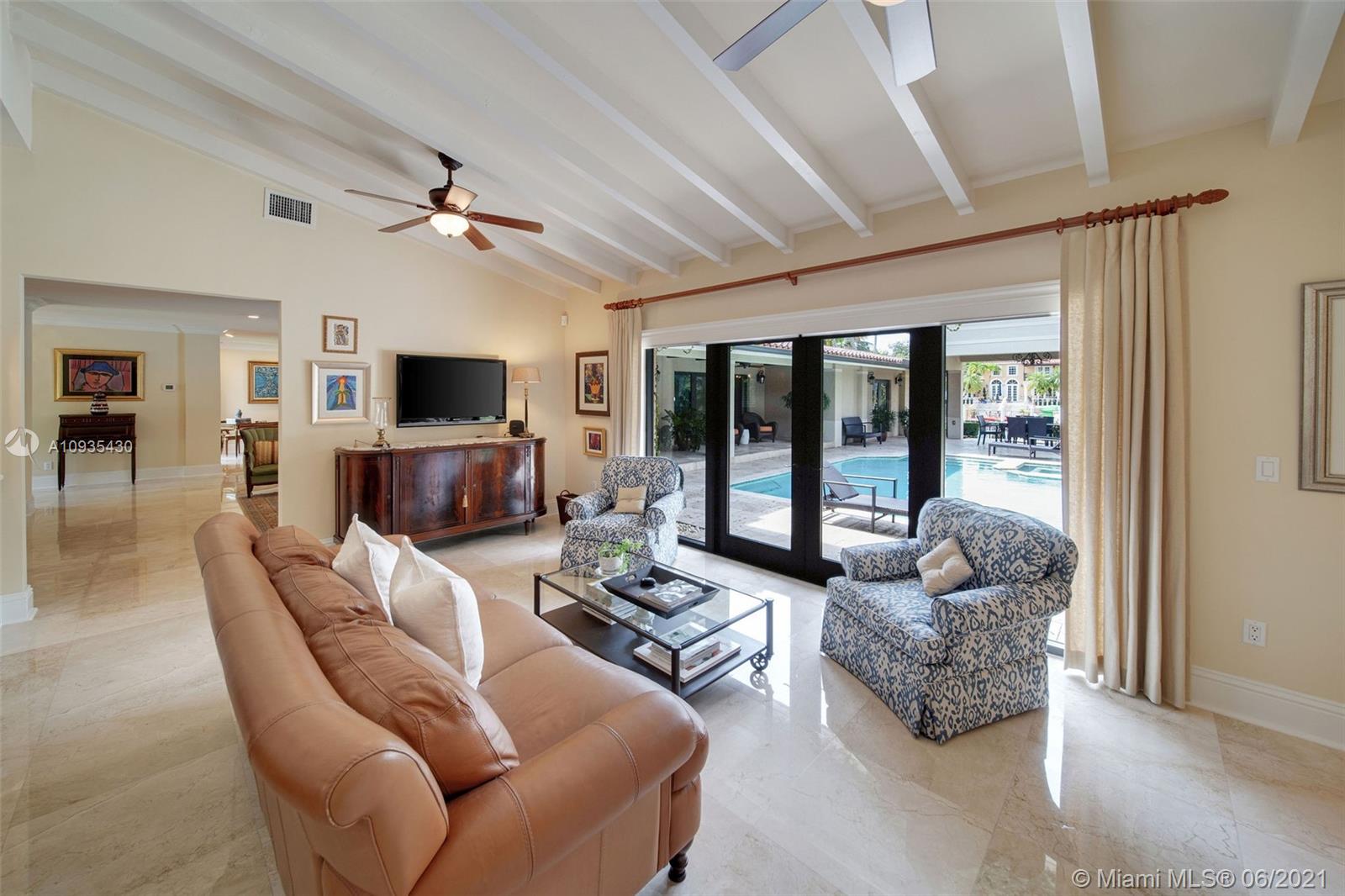 4804 Biltmore Drive Coral Gables, FL 33146 - Photo 15 of 47 a living room with furniture and a flat screen tv