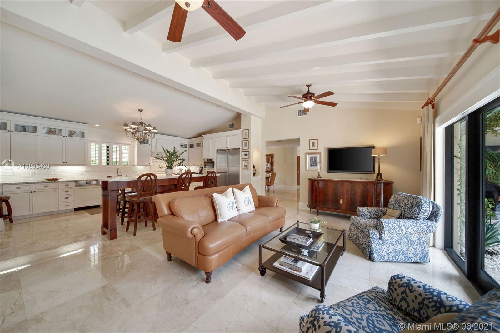 4804 Biltmore Drive Coral Gables, FL 33146 - Photo 16 of 47 a living room with furniture ceiling fan and a rug