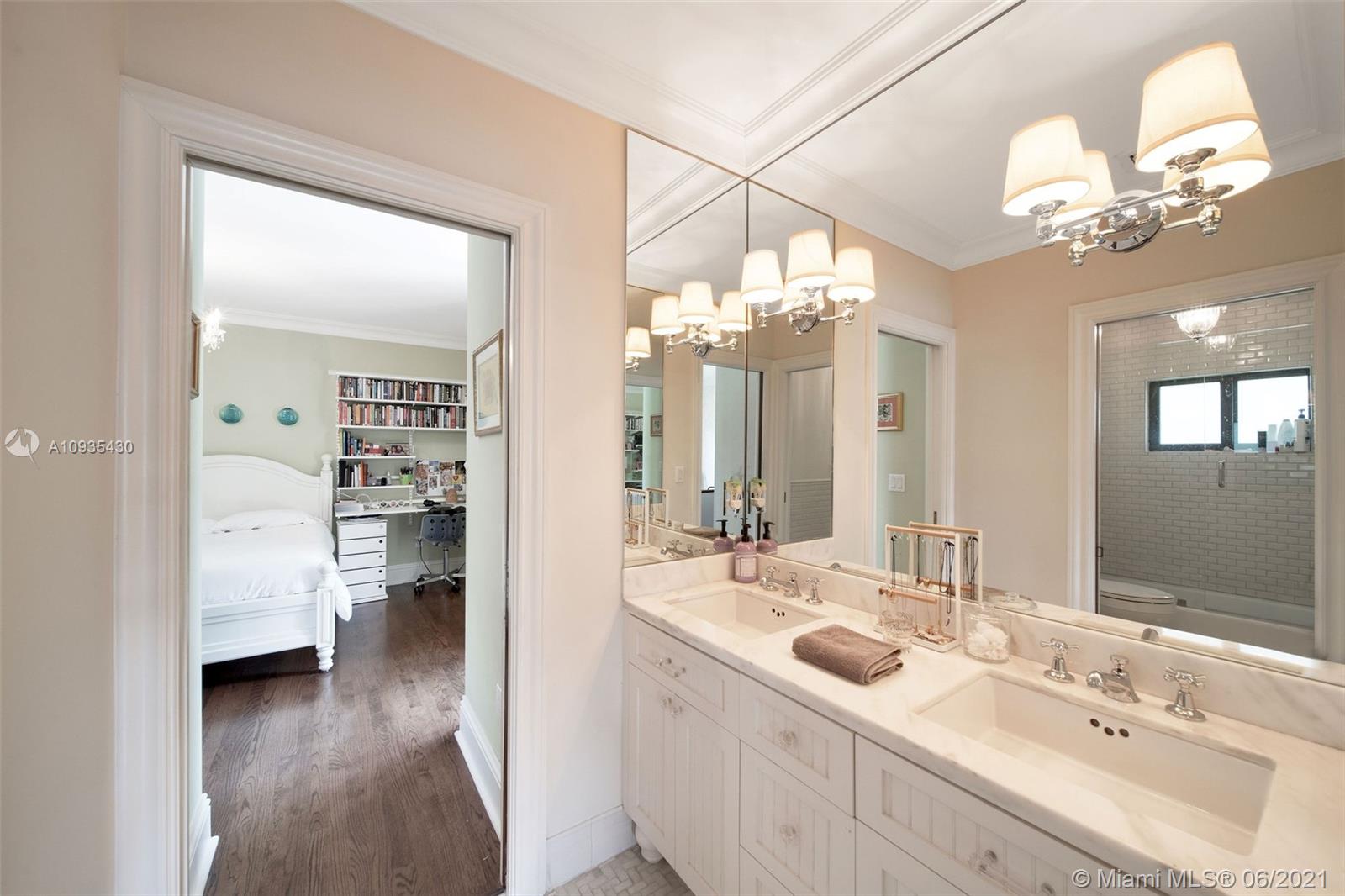 4804 Biltmore Drive Coral Gables, FL 33146 - Photo 20 of 47 a bathroom with a double vanity sink mirror and chandelier