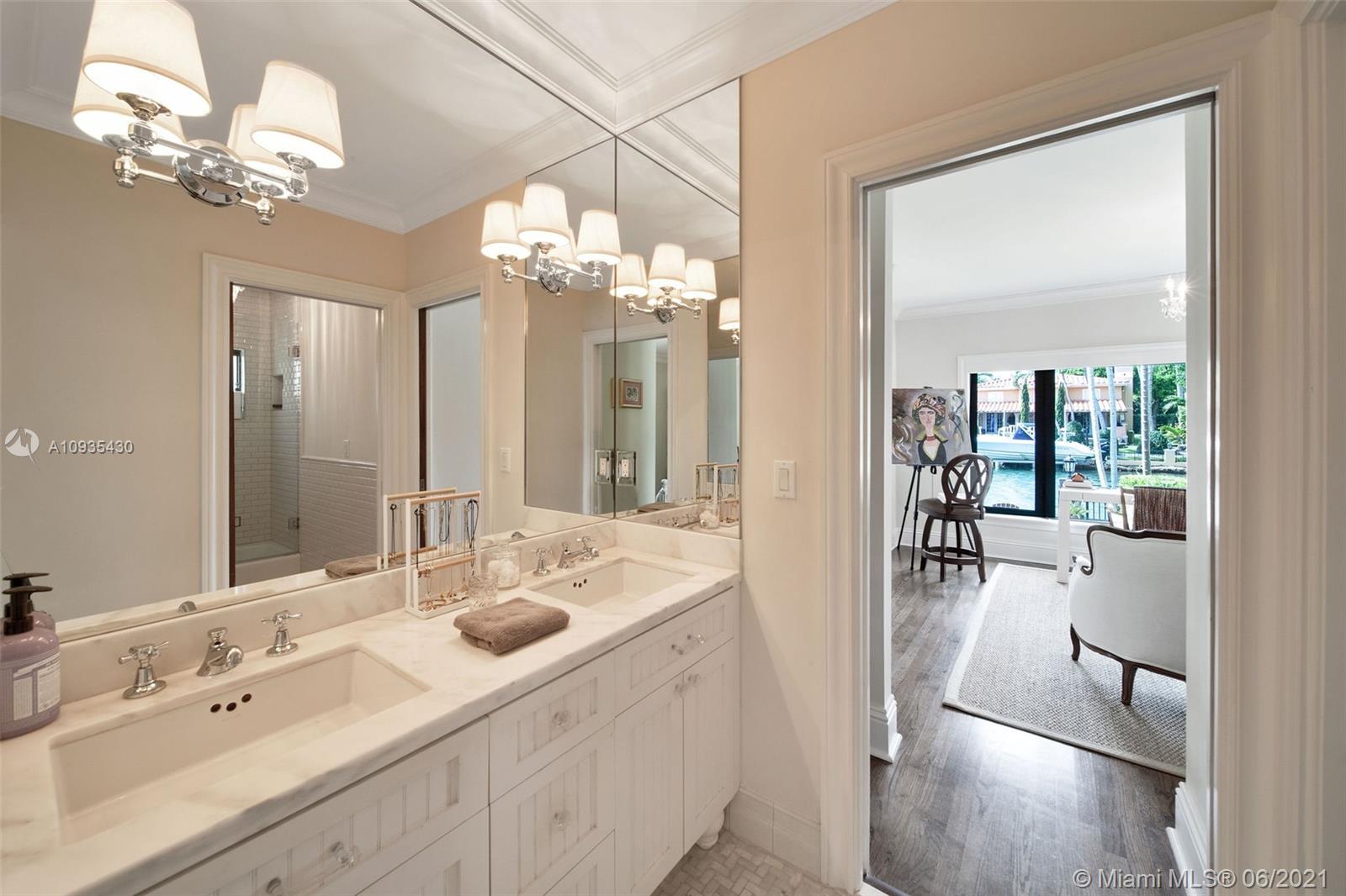 4804 Biltmore Drive Coral Gables, FL 33146 - Photo 23 of 47 a spacious en suite bathroom with a double sink and mirror