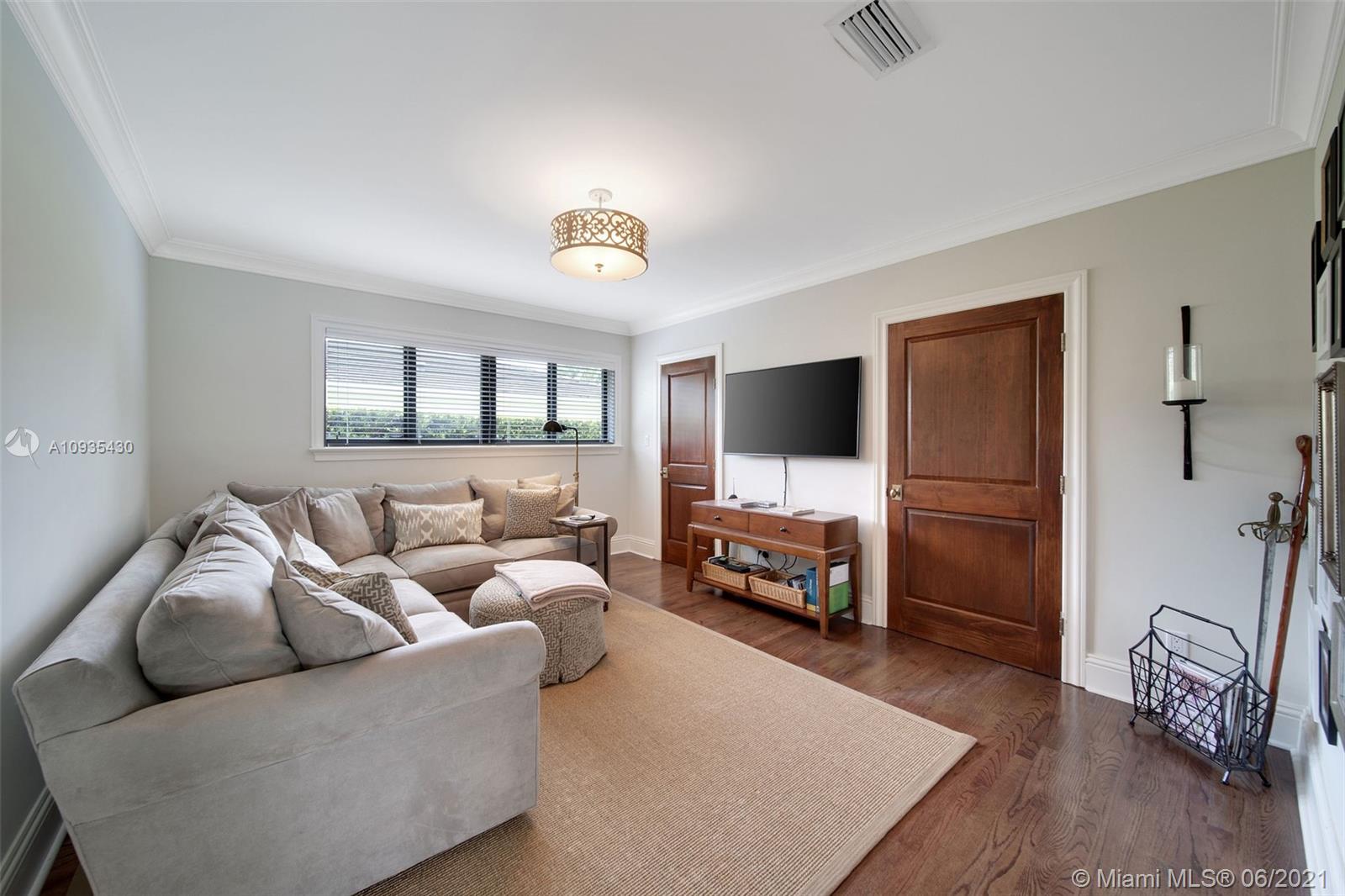 4804 Biltmore Drive Coral Gables, FL 33146 - Photo 25 of 47 a living room with furniture and a flat screen tv