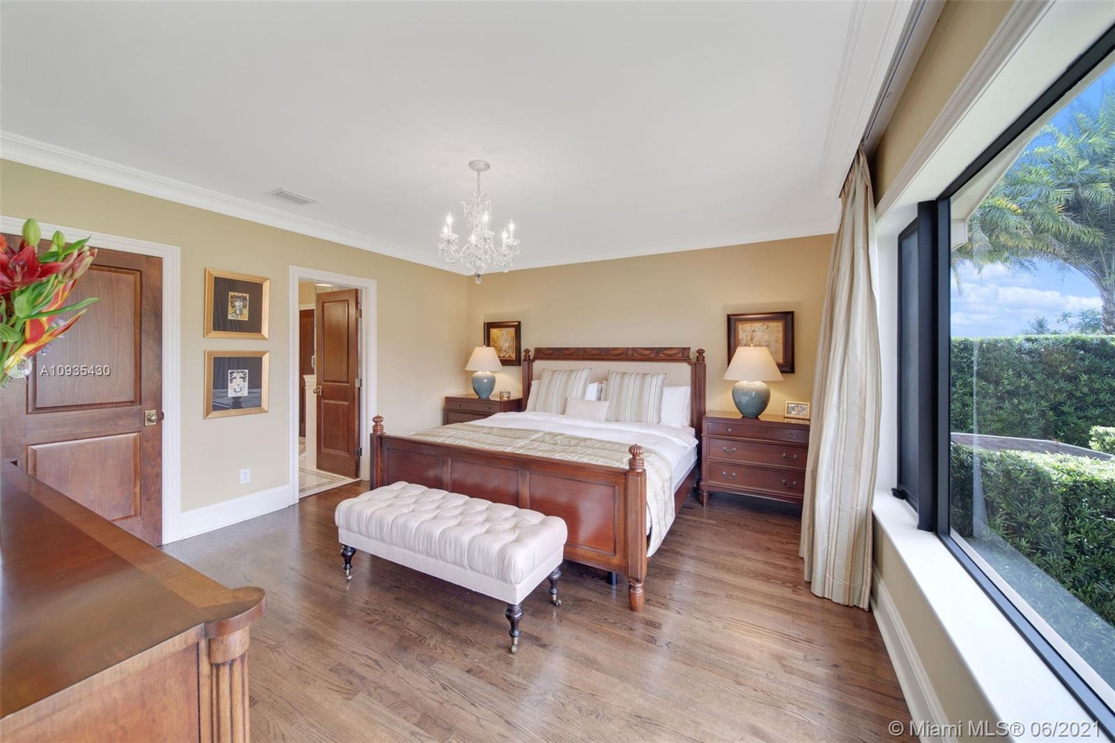 4804 Biltmore Drive Coral Gables, FL 33146 - Photo 32 of 47 a bedroom with a bed and wooden floor