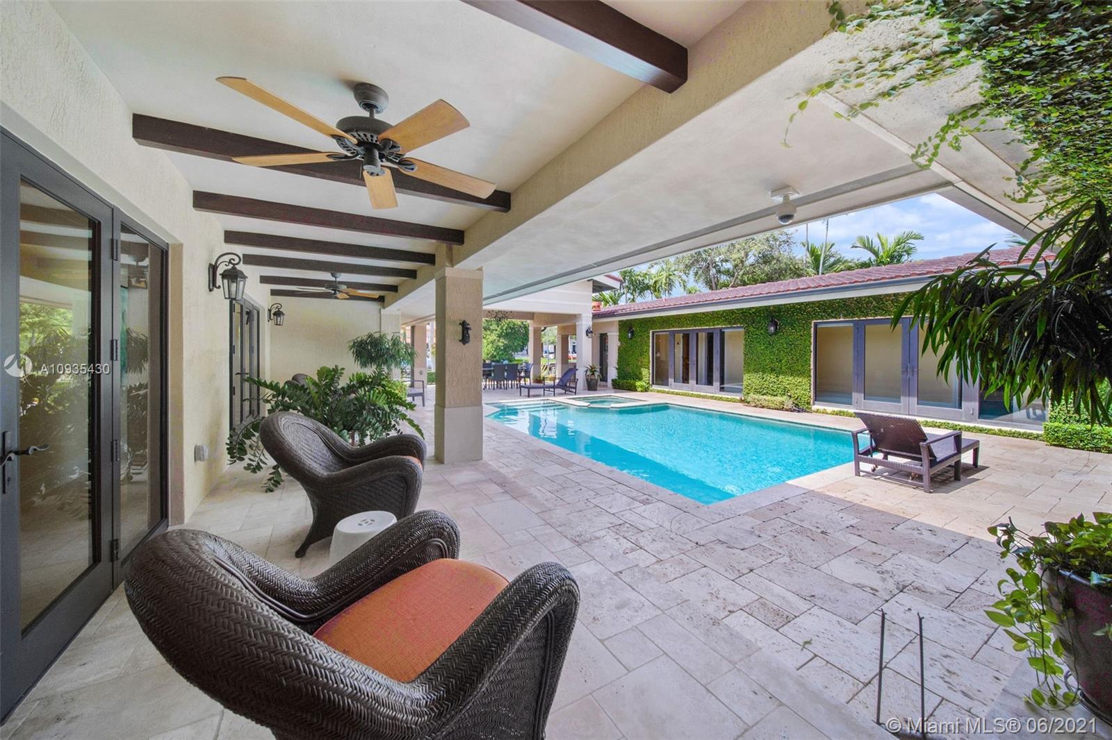 4804 Biltmore Drive Coral Gables, FL 33146 - Photo 37 of 47 a view of a patio with table and chairs and potted plants