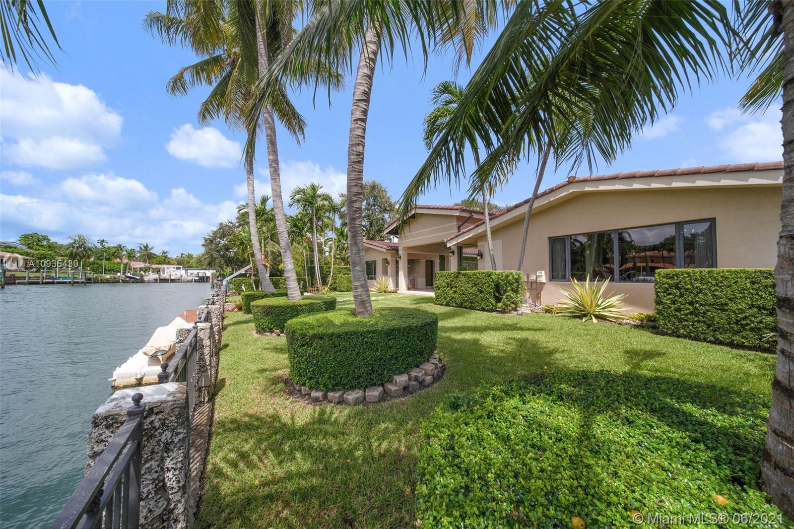 4804 Biltmore Drive Coral Gables, FL 33146 - Photo 42 of 47 a front view of a house with balcony and garden