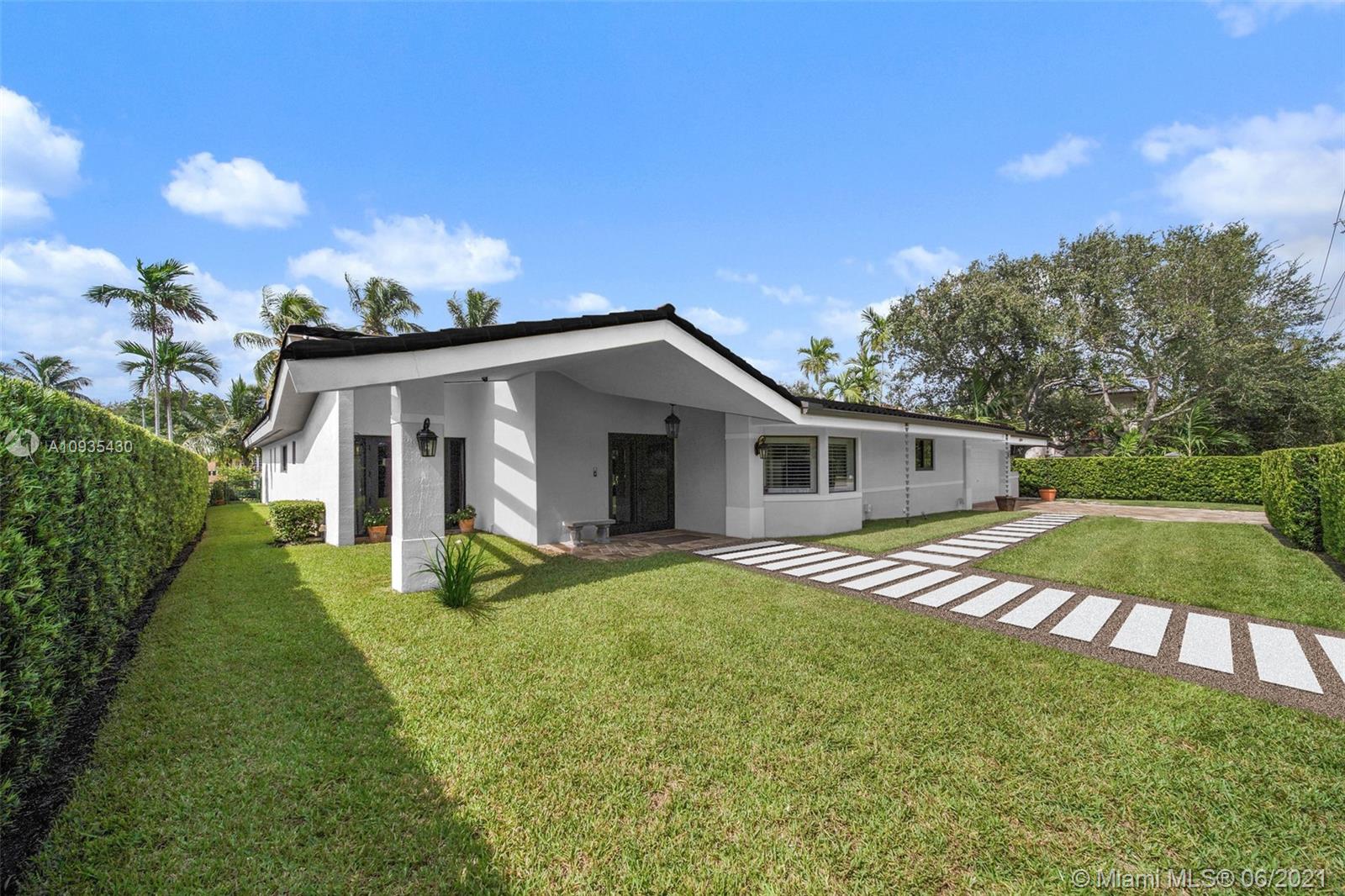 4804 Biltmore Drive Coral Gables, FL 33146 - Photo 47 of 47 a front view of a house with garden