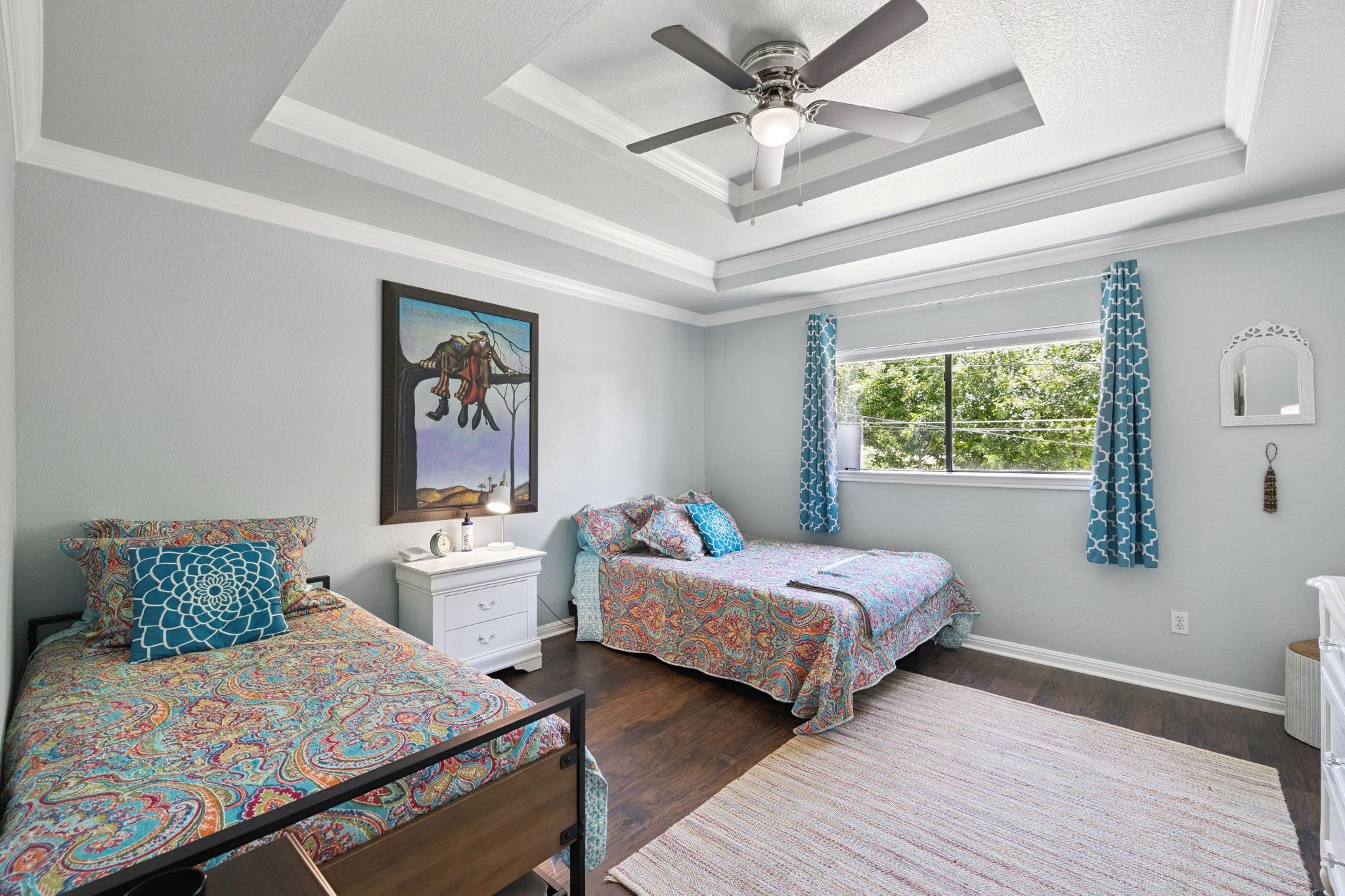 1435 East Zipp Road New Braunfels, TX 78130 - Photo 35 of 43 a bedroom with two beds and a window