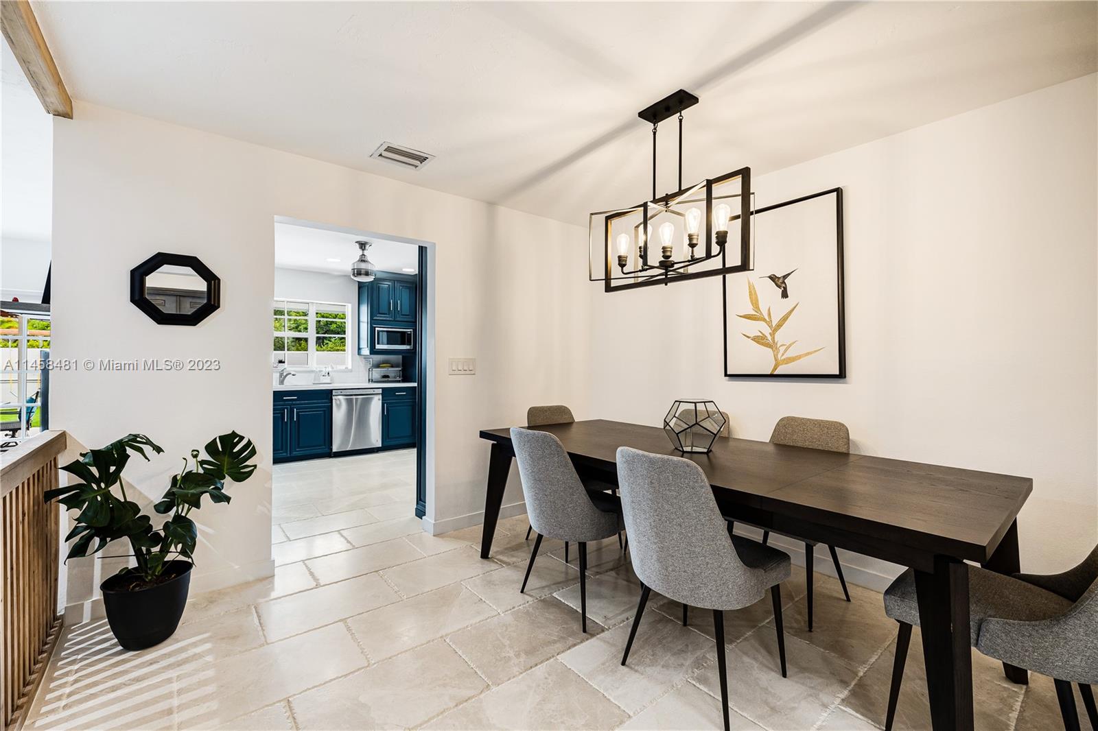 10520 Southwest 103rd Avenue Miami, FL 33176 - Photo 11 of 51 a view of a dining room with furniture and chandelier