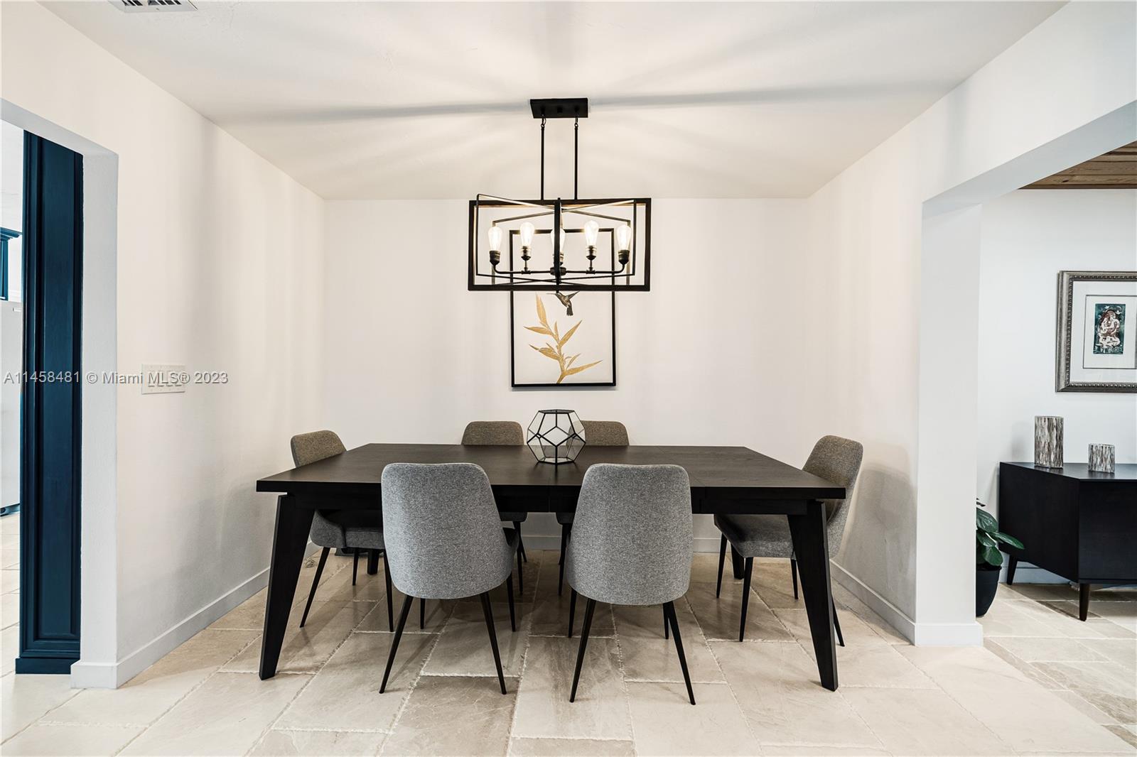 10520 Southwest 103rd Avenue Miami, FL 33176 - Photo 12 of 51 a view of a dining room with furniture wooden floor and a window