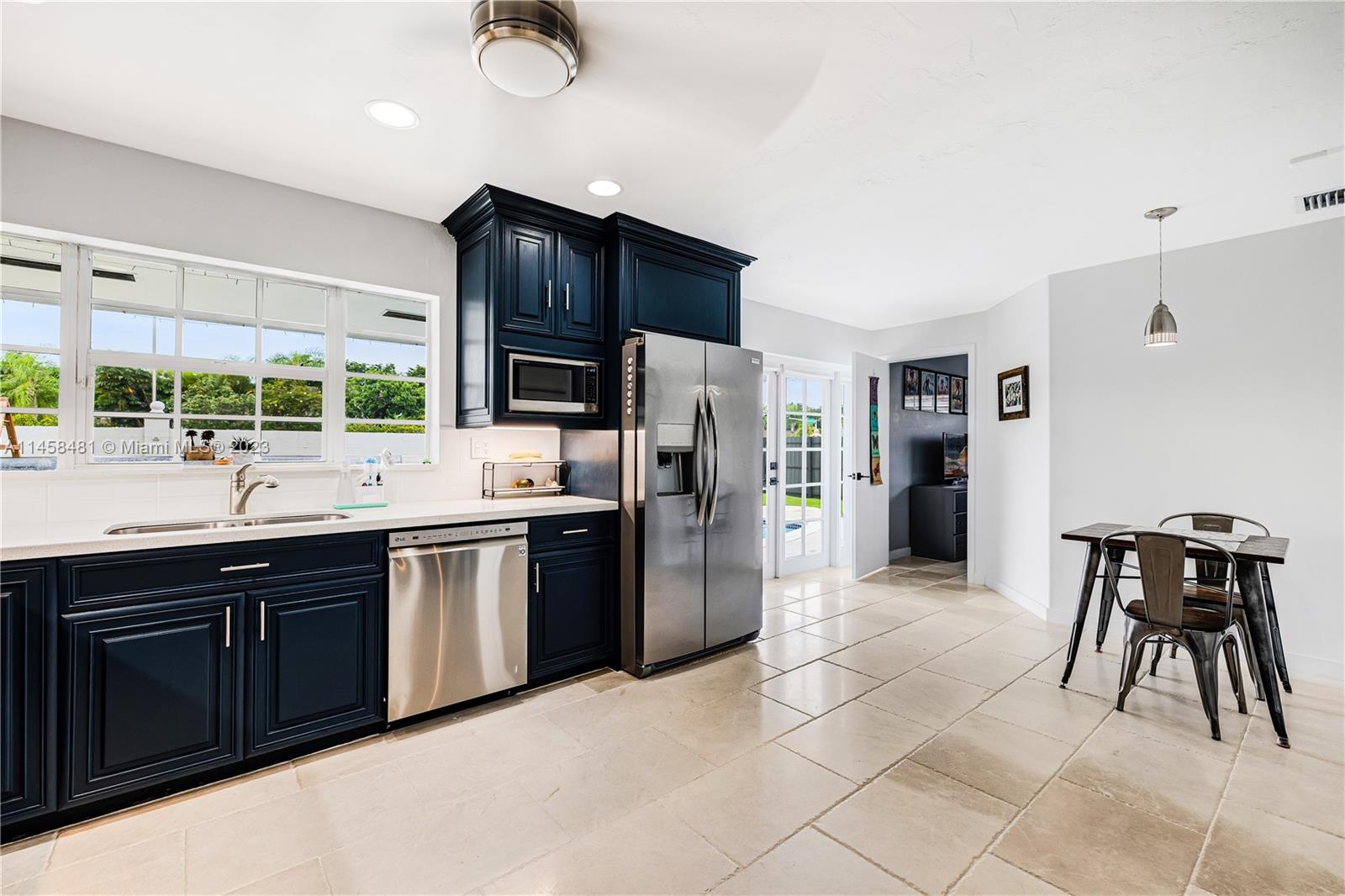 10520 Southwest 103rd Avenue Miami, FL 33176 - Photo 16 of 51 a kitchen with stainless steel appliances granite countertop a refrigerator and a sink