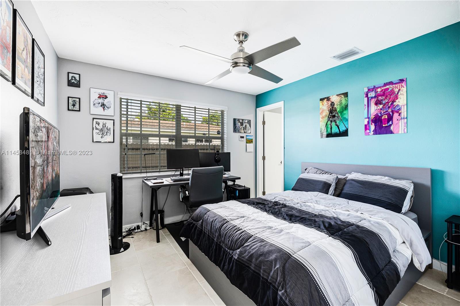 10520 Southwest 103rd Avenue Miami, FL 33176 - Photo 18 of 51 a bedroom with a bed and a flat screen tv