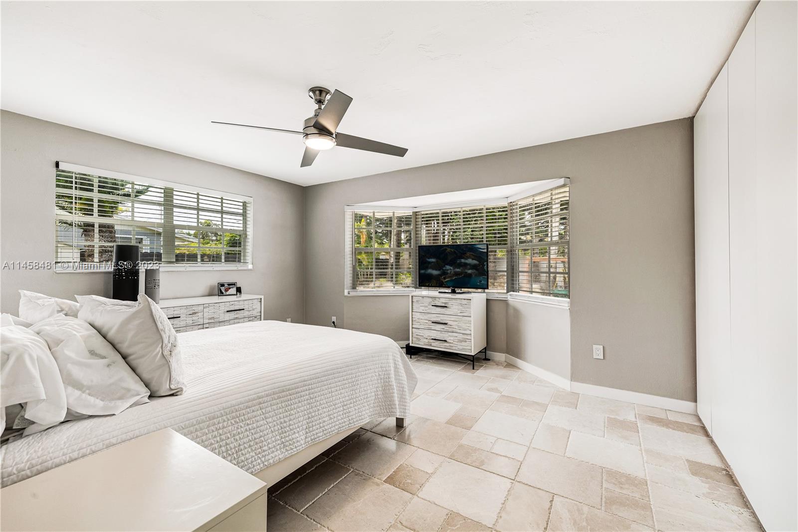 10520 Southwest 103rd Avenue Miami, FL 33176 - Photo 29 of 51 a bedroom with a large bed and a window