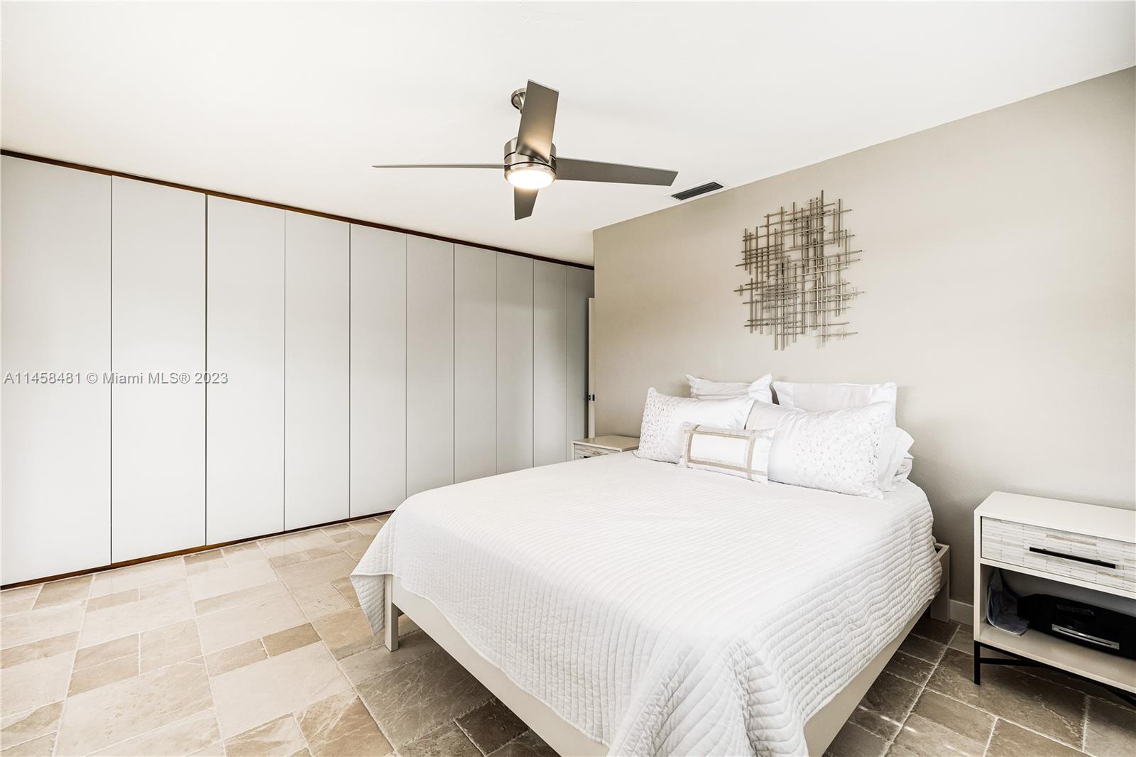 10520 Southwest 103rd Avenue Miami, FL 33176 - Photo 30 of 51 a large bed sitting in a bedroom and chandelier