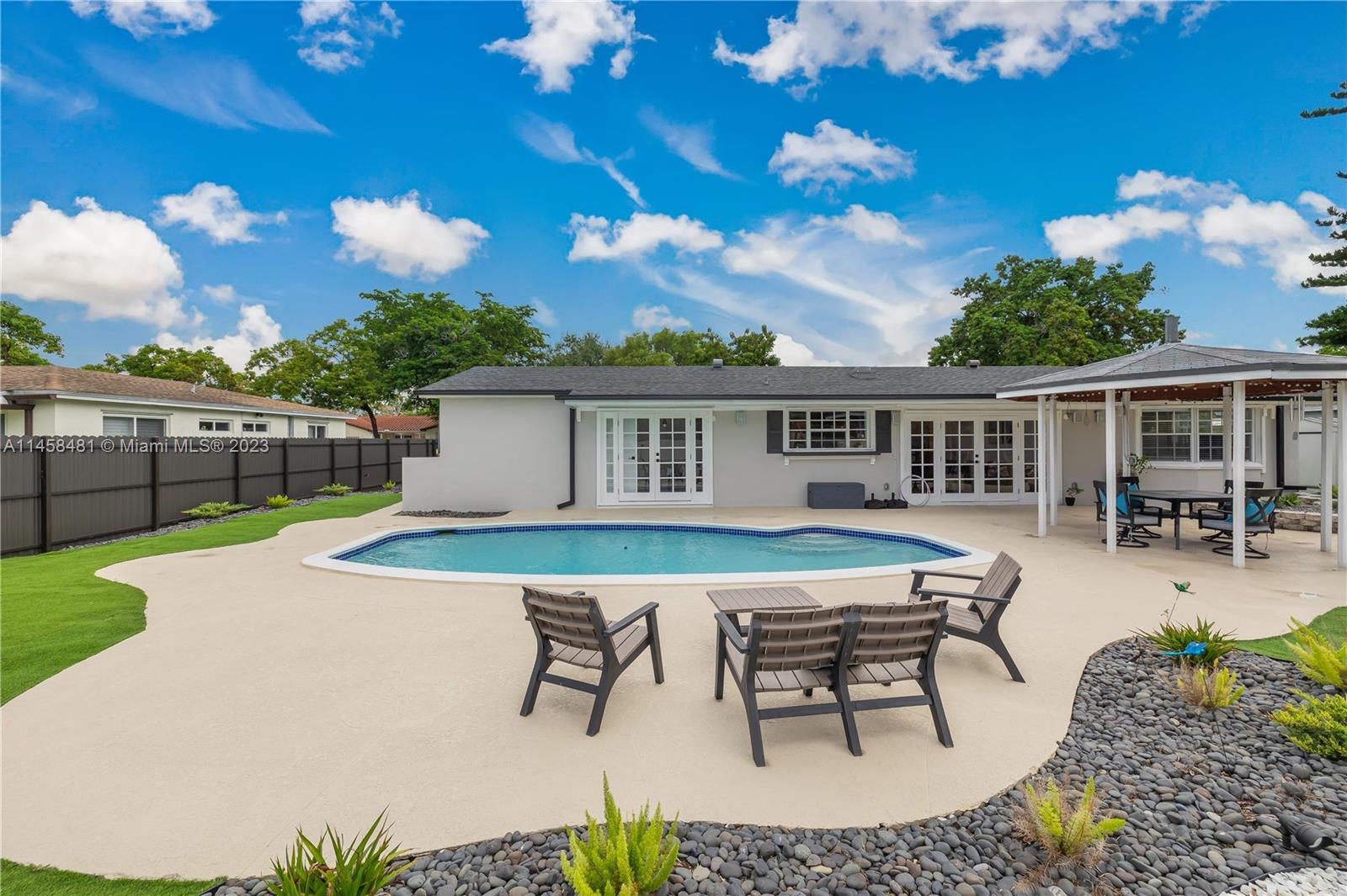 10520 Southwest 103rd Avenue Miami, FL 33176 - Photo 36 of 51 a view of a house with backyard sitting area and garden