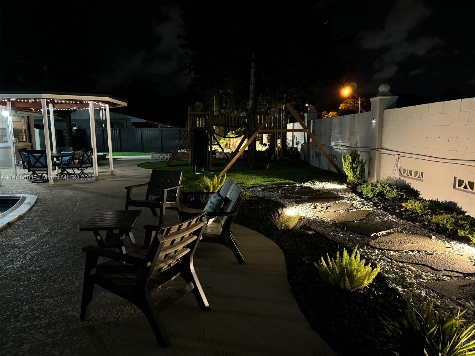 10520 Southwest 103rd Avenue Miami, FL 33176 - Photo 50 of 51 a view of a house with backyard and sitting area