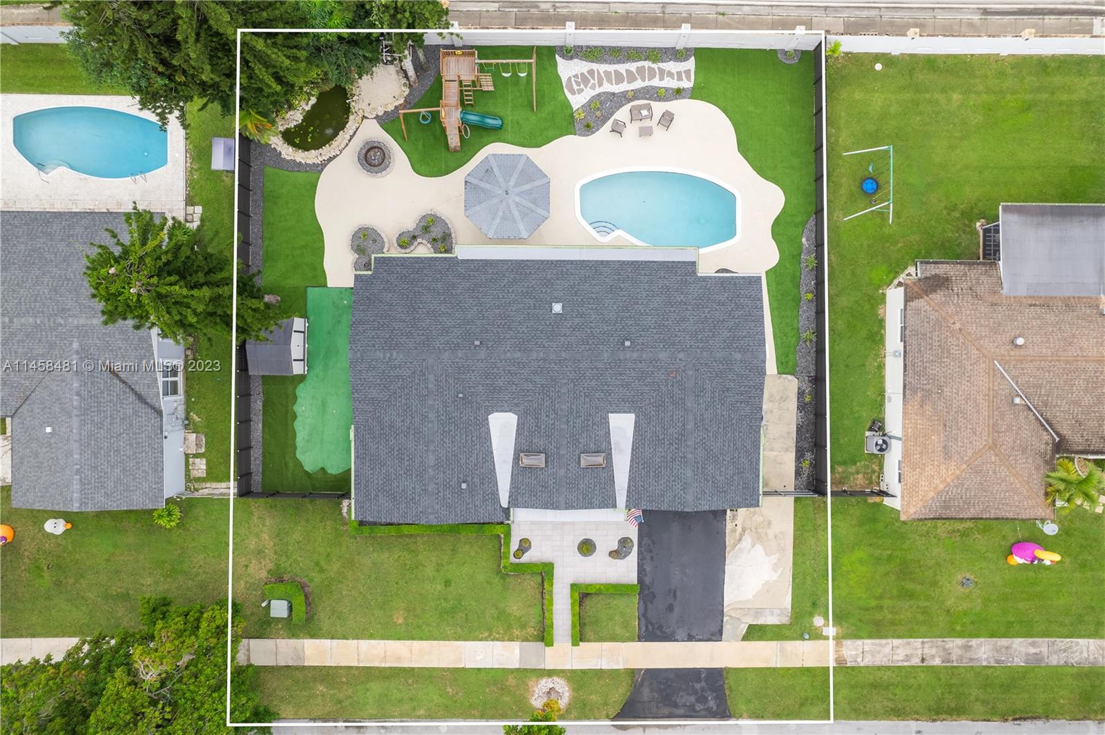 10520 Southwest 103rd Avenue Miami, FL 33176 - Photo 5 of 51 an aerial view of a house having yard