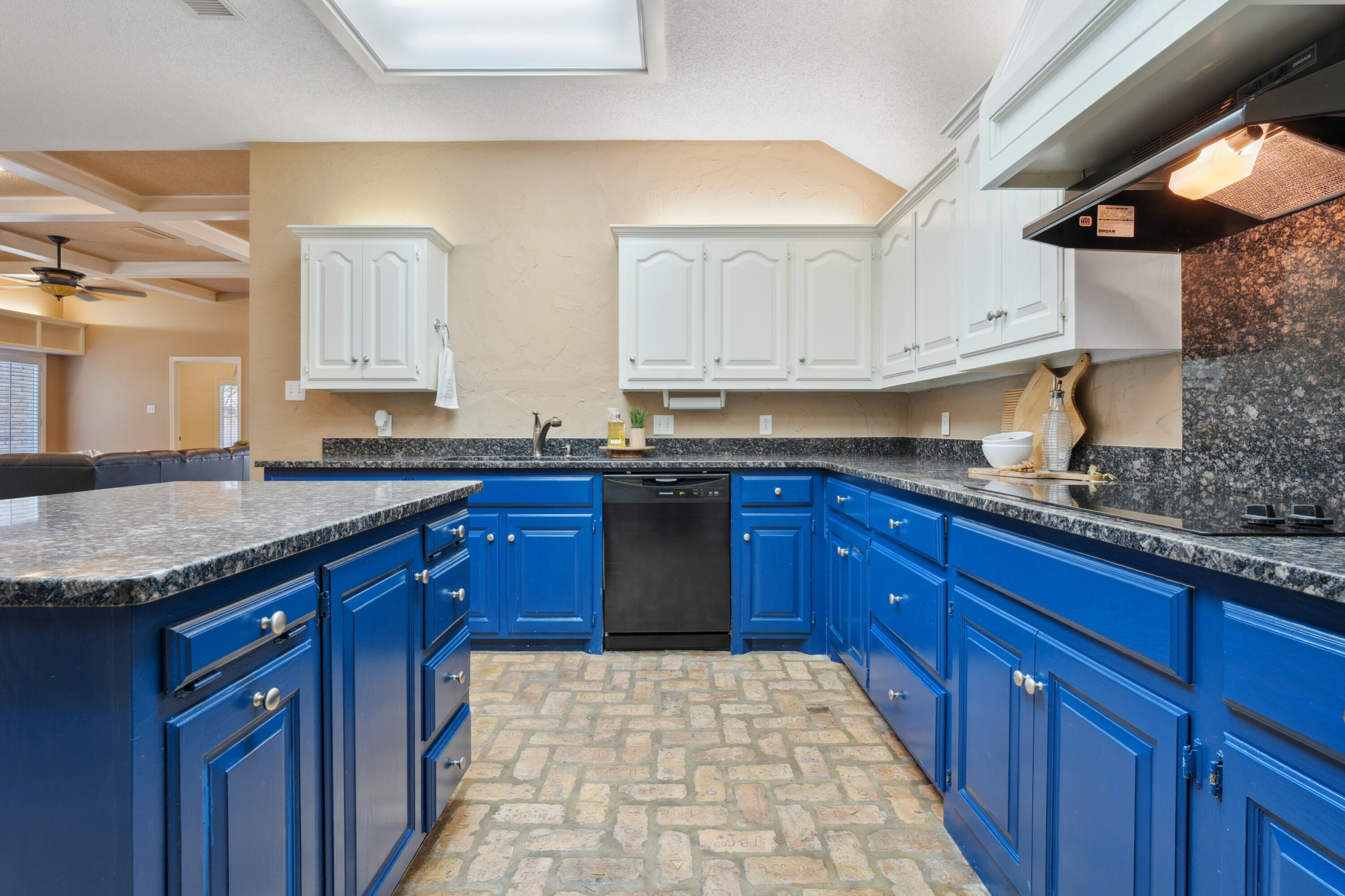 102 North Utica Avenue Lubbock, TX 79416 - Photo 14 of 36 a kitchen with granite countertop a sink stove and cabinets