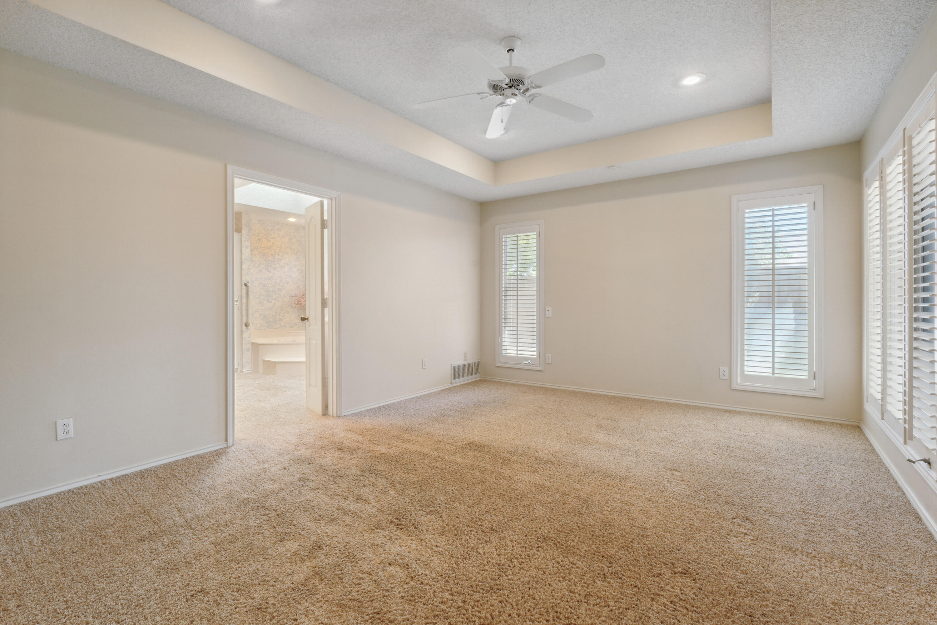 102 North Utica Avenue Lubbock, TX 79416 - Photo 19 of 36 an empty room with windows and closet
