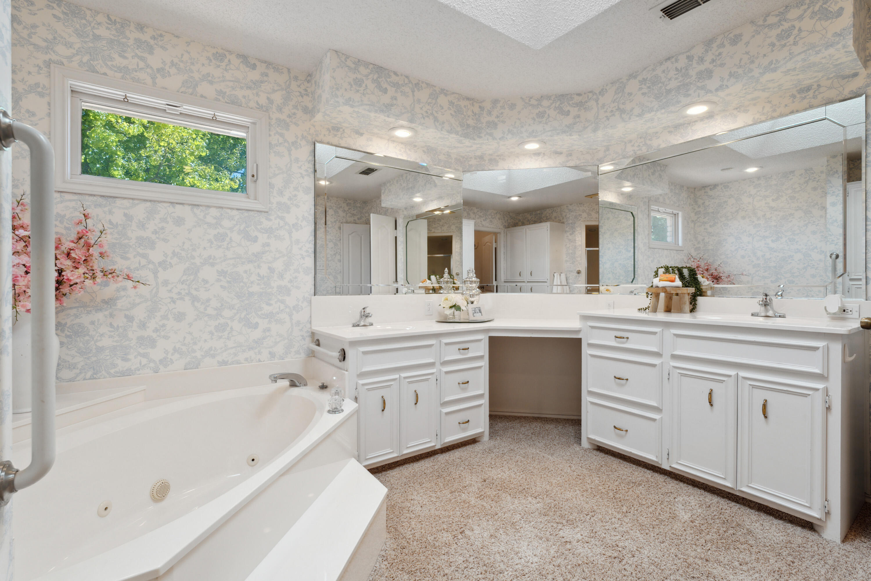 102 North Utica Avenue Lubbock, TX 79416 - Photo 21 of 36 a bathroom with a bathtub shower sink and mirror
