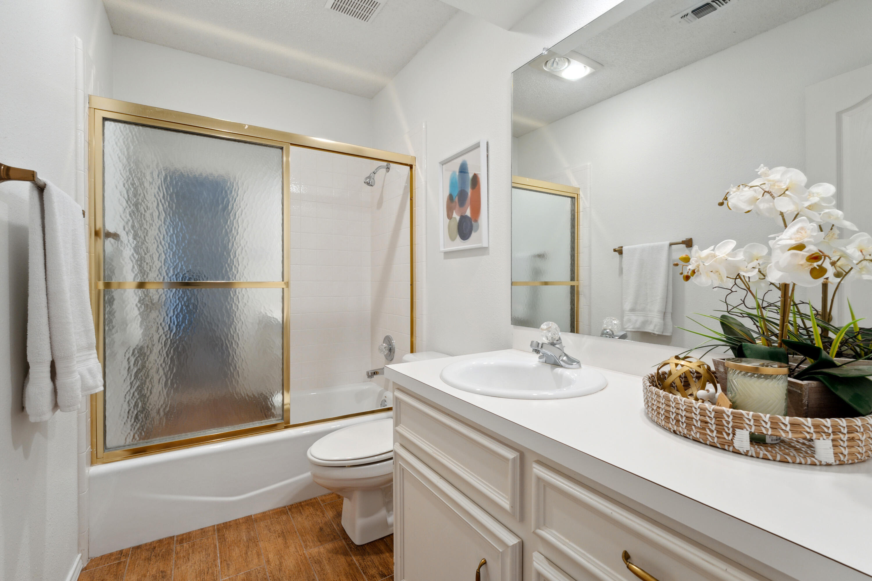 102 North Utica Avenue Lubbock, TX 79416 - Photo 26 of 36 a bathroom with a sink a toilet and shower