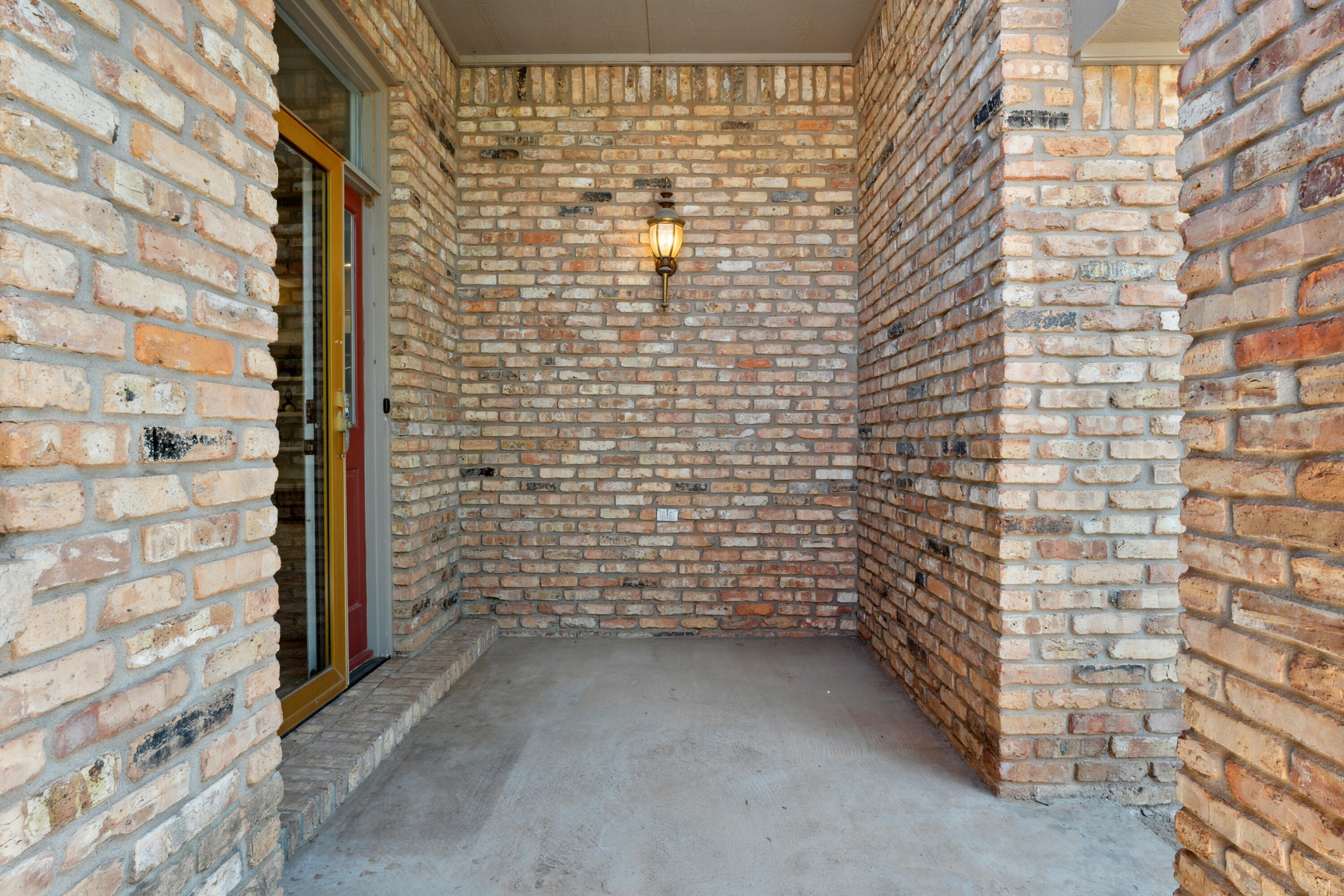 102 North Utica Avenue Lubbock, TX 79416 - Photo 3 of 36 a view of a brick wall