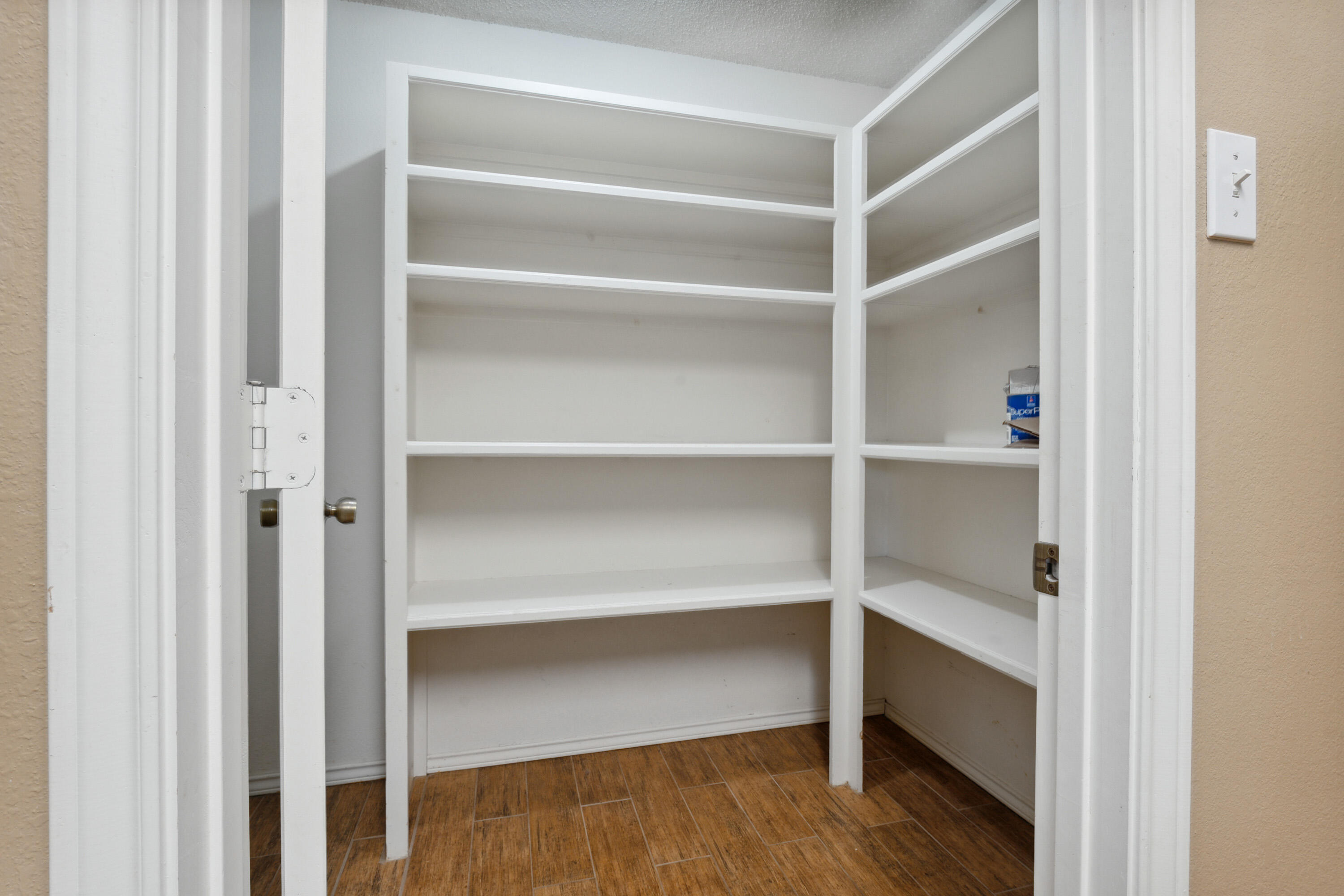 102 North Utica Avenue Lubbock, TX 79416 - Photo 31 of 36 a view of walk in closet with empty racks