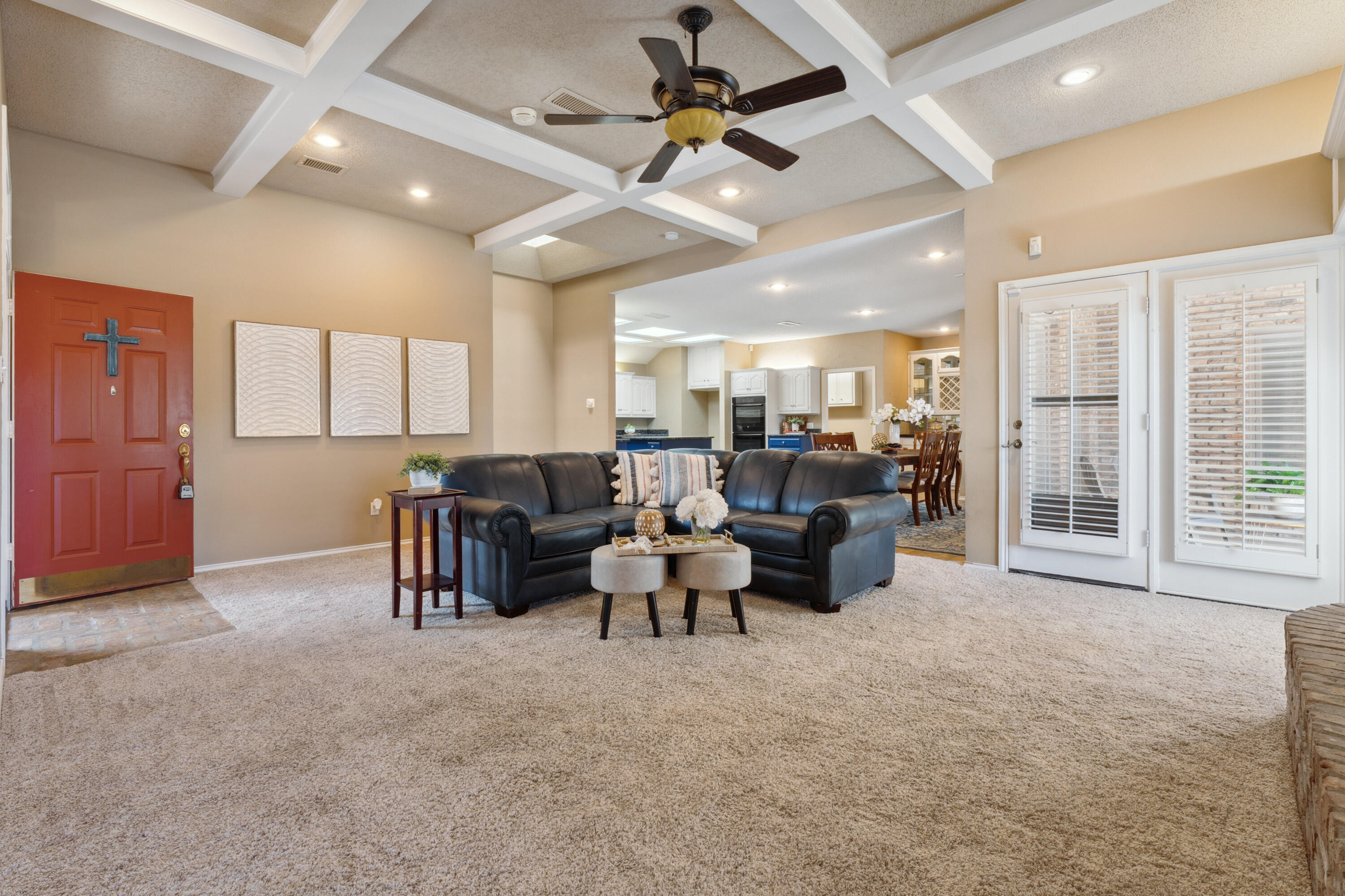 102 North Utica Avenue Lubbock, TX 79416 - Photo 9 of 36 a living room with furniture and a large window
